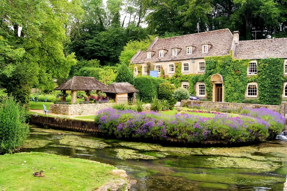 Old stone cottages along a lane in Bibury